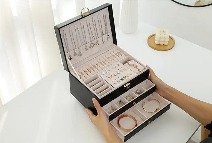 Compact multilayer jewelry box, secure and stylish storage for rings, earrings.