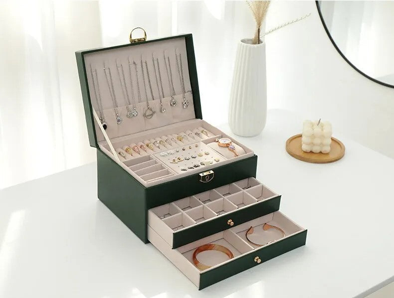 White multilayer jewelry box, sleek design for organized vanity storage of women's accessories.