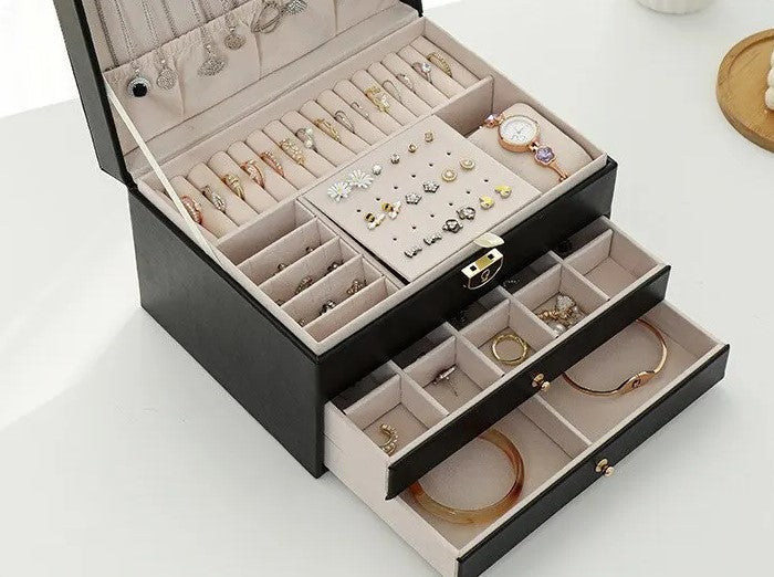 Multilayer jewelry storage box, elegant leather design for women's diverse accessory collection.