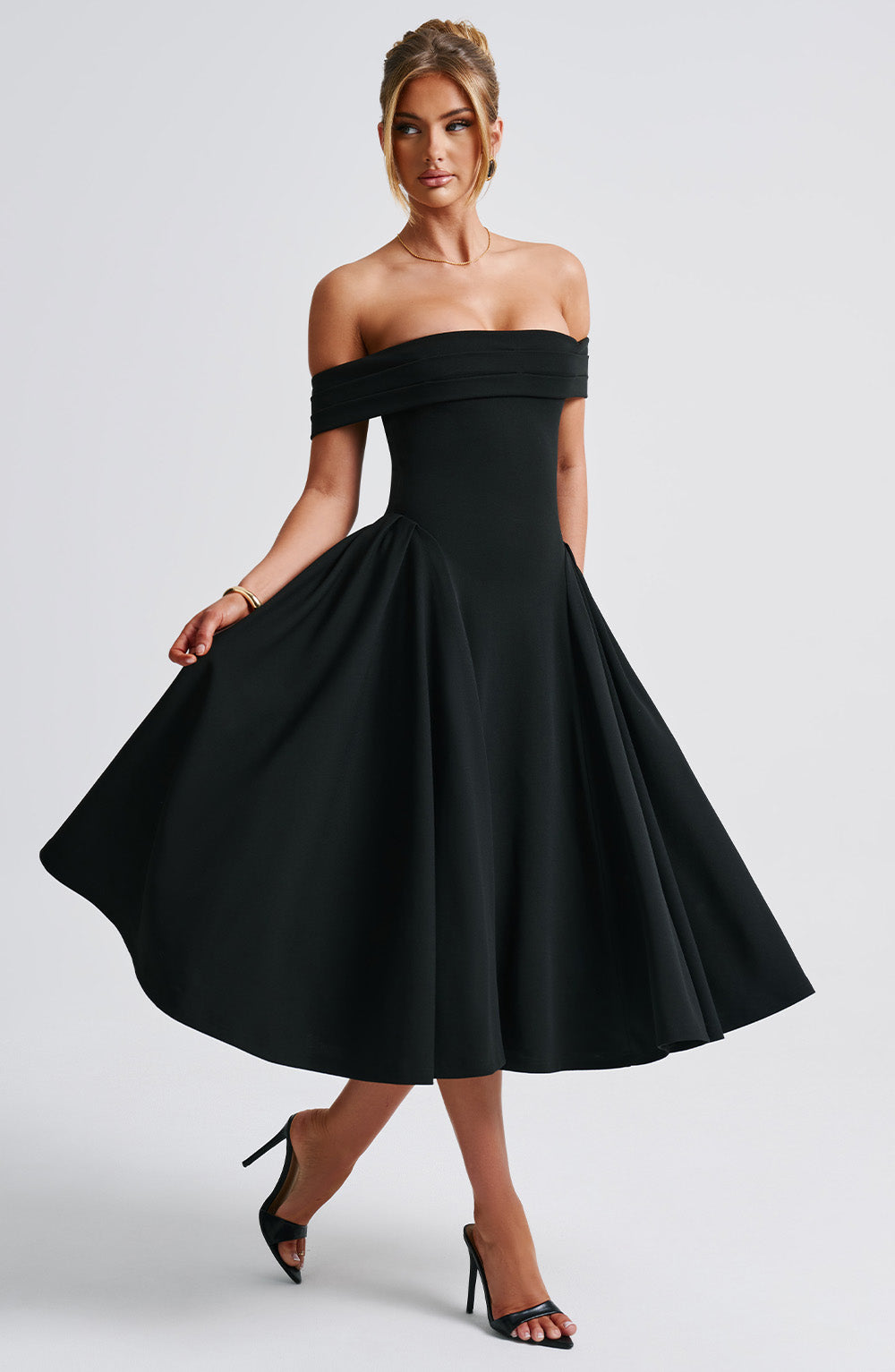 Elegant off-shoulder A-line midi dress in classic colors, designed to highlight graceful silhouettes for formal events.