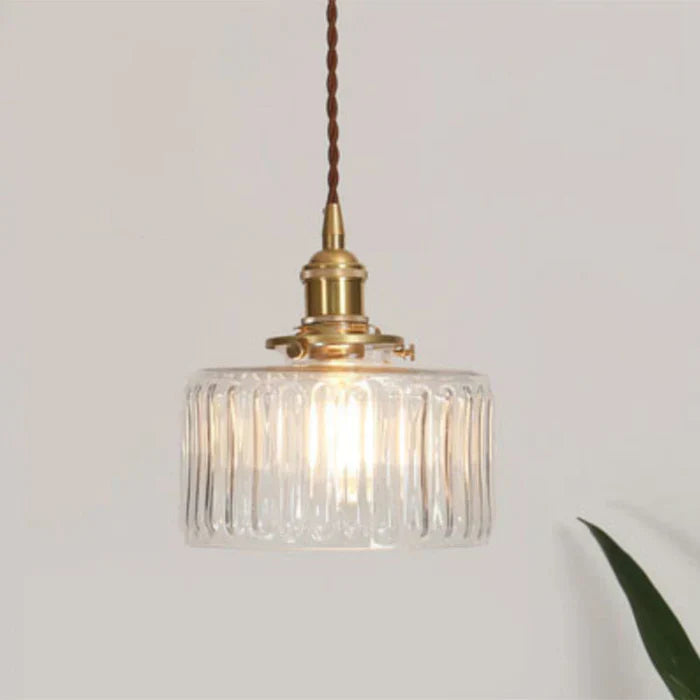Modern transparent glass pendant lamp, perfect for kitchen island lighting.