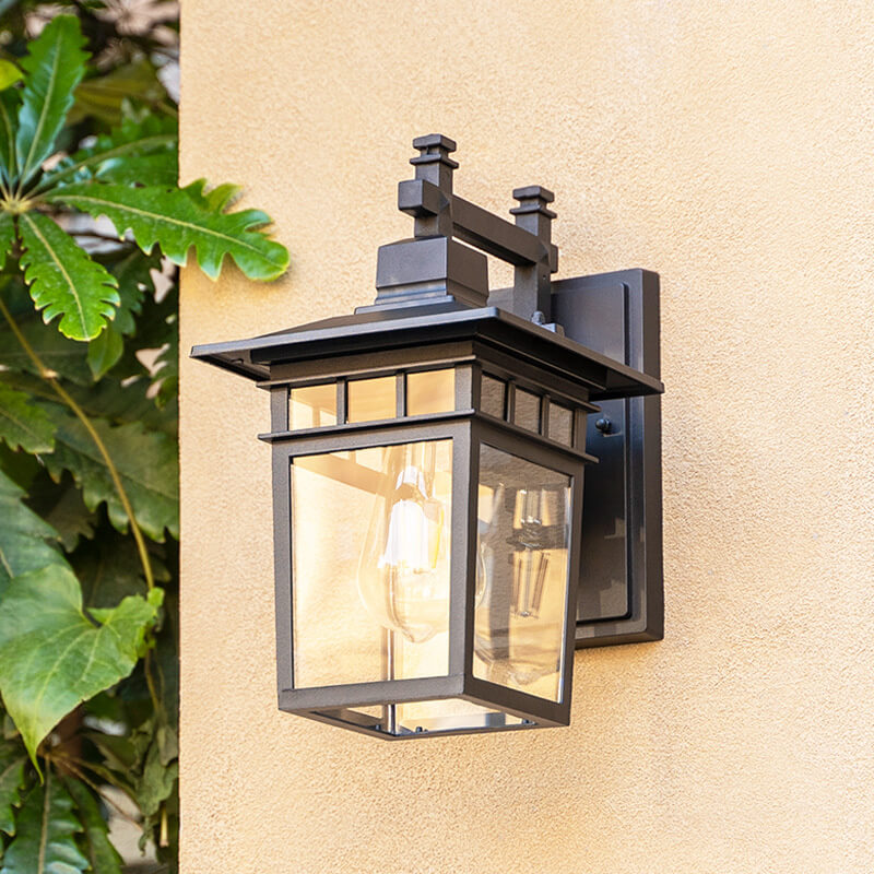 "Elegant outdoor waterproof lantern wall light with black finish and glass shade, perfect for gardens and porches."