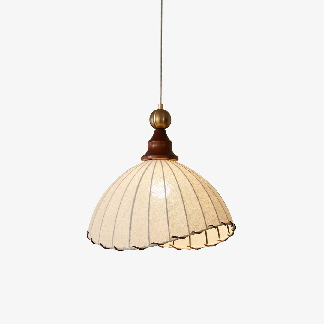 Elegant pendant light with pleated fabric shade, gold-finished top, and wood accent; perfect for modern interiors.