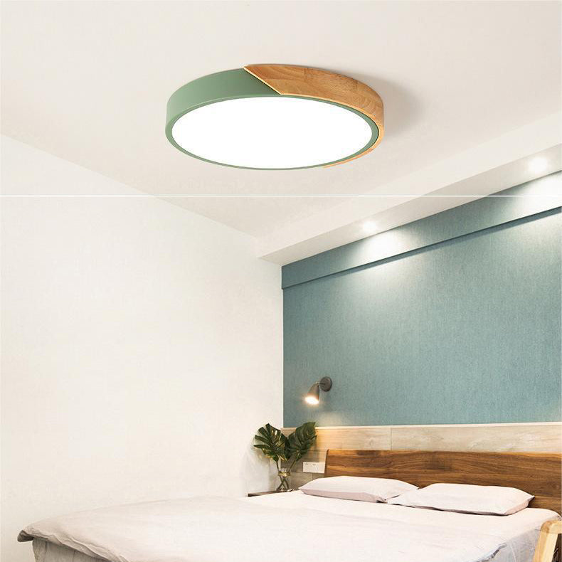 "Elegant Scandinavian Circular LED Ceiling Light Fixture with minimalist design, warm glow, and wood finish option."