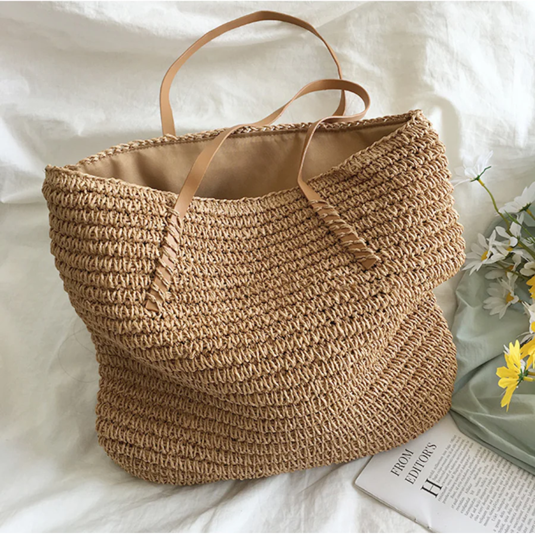 Woman carrying a spacious white TerraWoven shoulder bag, an elegant & versatile daily fashion accessory.