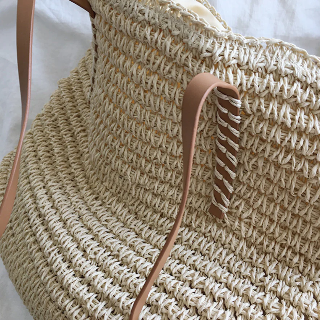 Brown TerraWoven elegant shoulder bag on display. A durable, spacious woven tote & versatile women's accessory.
