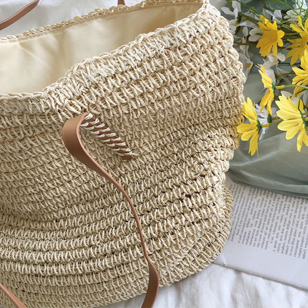White TerraWoven elegant shoulder bag on display. A durable, spacious woven tote & versatile women's accessory.