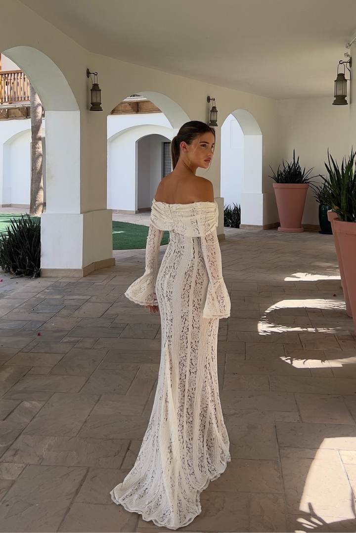 Formal white off-shoulder maxi dress, perfect as a wedding guest or elegant evening gown.