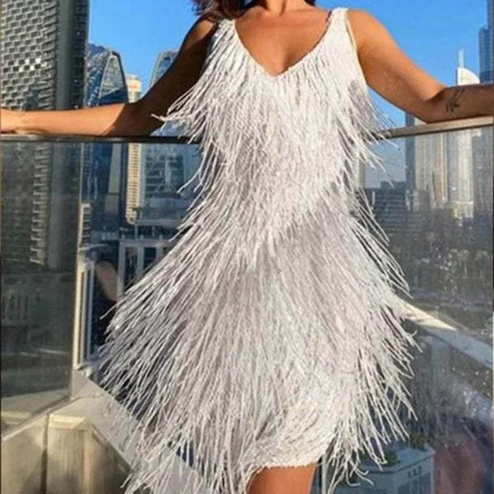 Stylish women's black tassel mini dress. Perfect occasion wear, party dress, or chic holiday outfit.