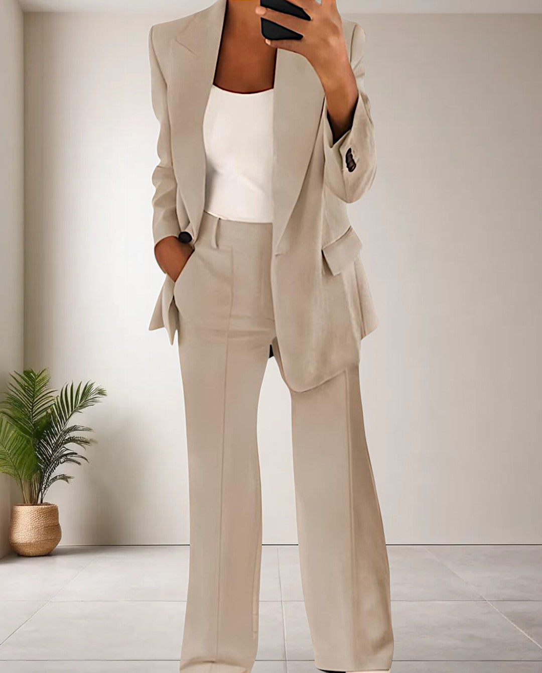 Stylish women's coordinated pantsuit featuring a chic blazer & matching trousers, perfect for office or events.