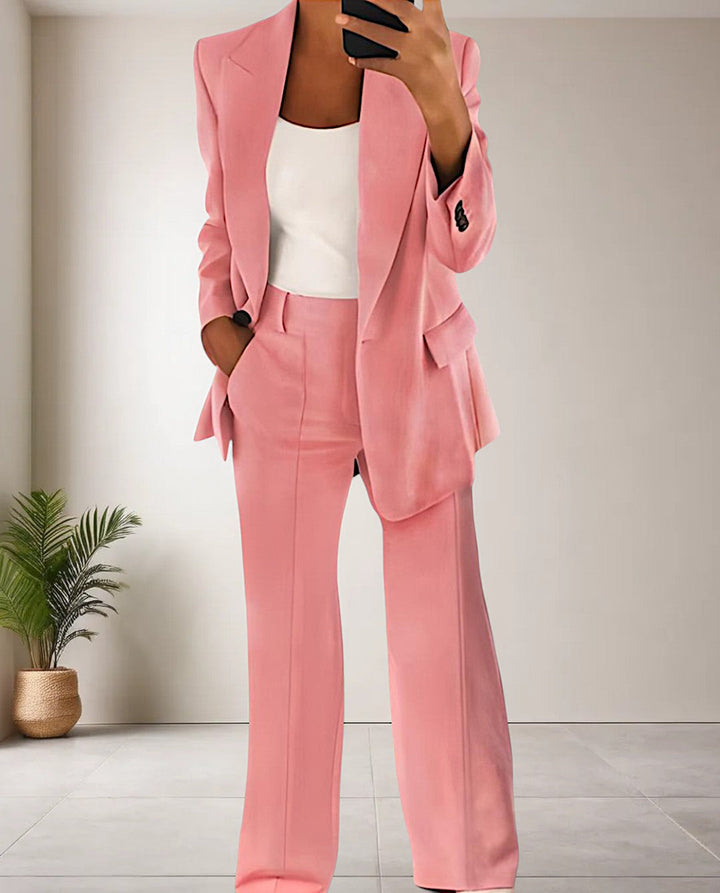 Trendy women's professional pantsuit set. Two-piece blazer and trousers for business wear and elegant office fashion.