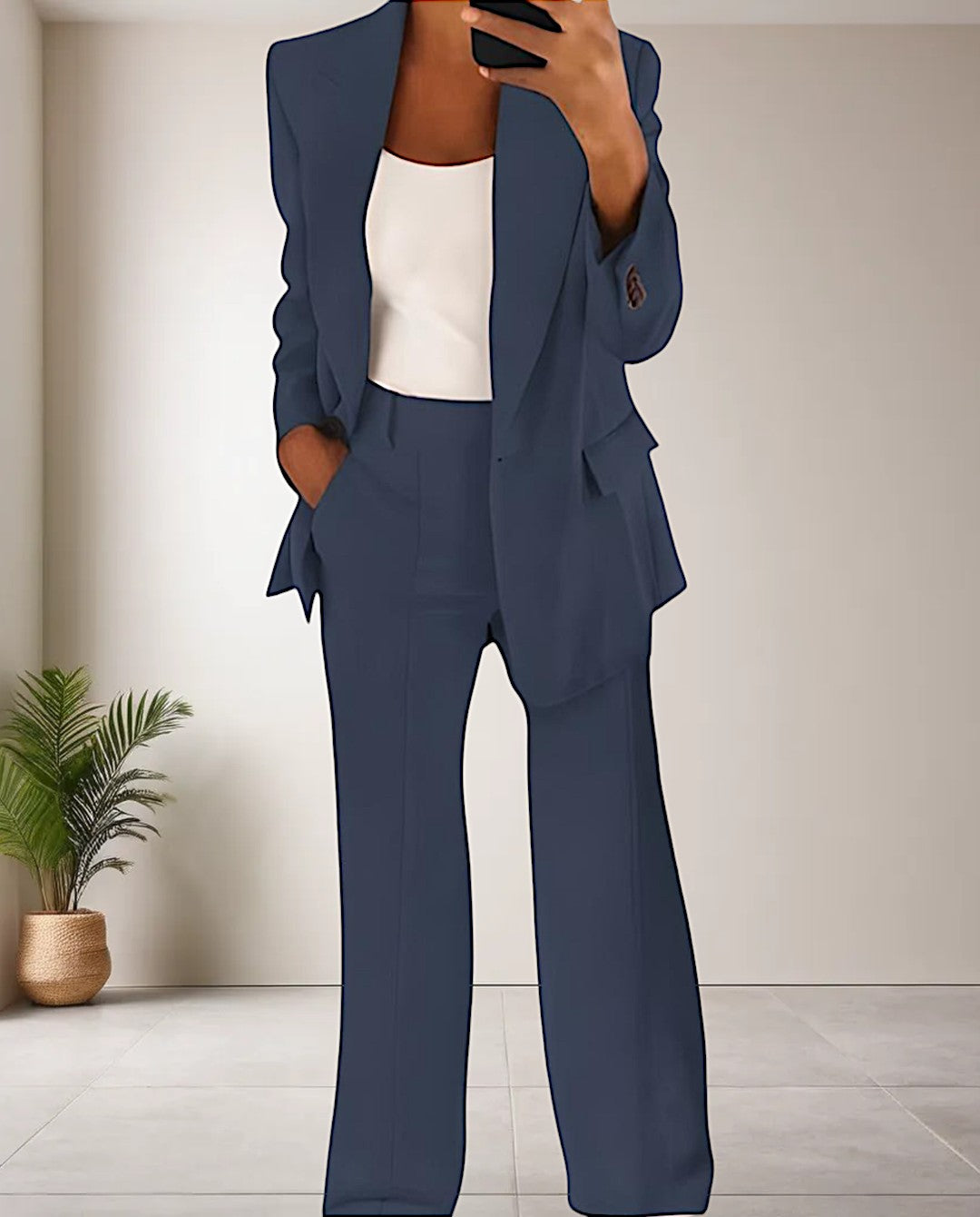 Coordinated women's elegant pantsuit. Two-piece set with a stylish blazer & trousers for a modern professional look.