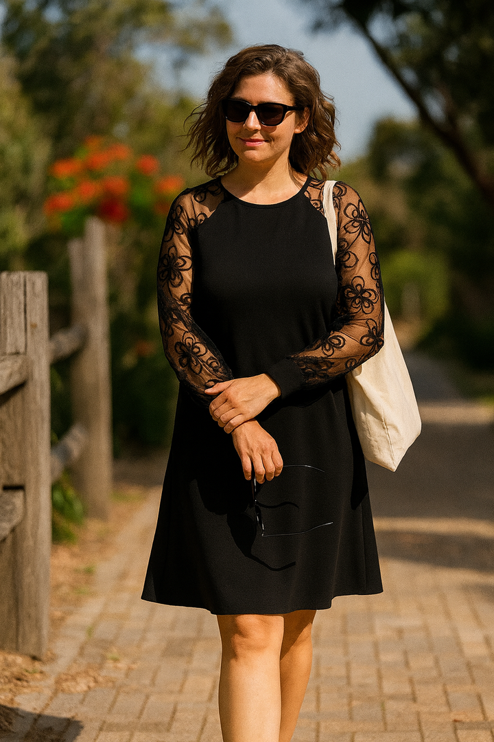 Women's midi A-line formal party dress with sophisticated sheer embroidered sleeves, suitable for special events.
