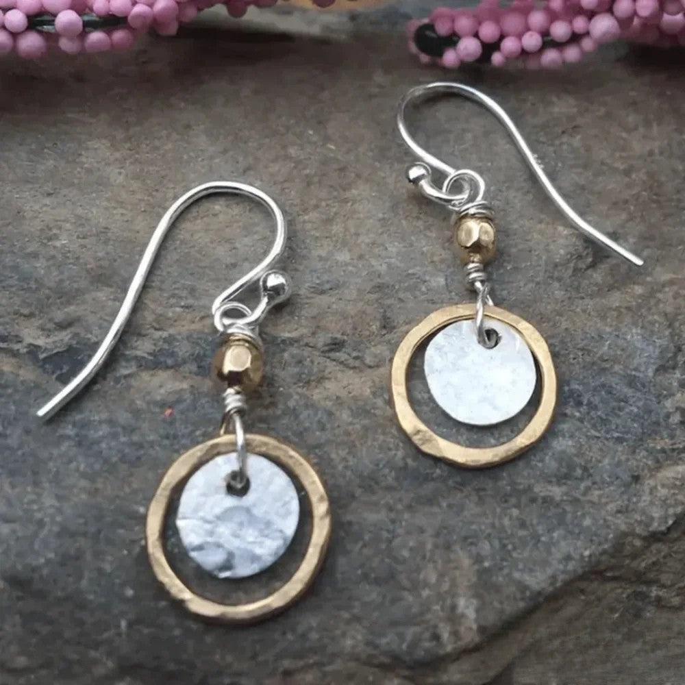 Elegant women's antique gold & silver two-tone hoop earrings. Vintage style fashion jewelry accessory.