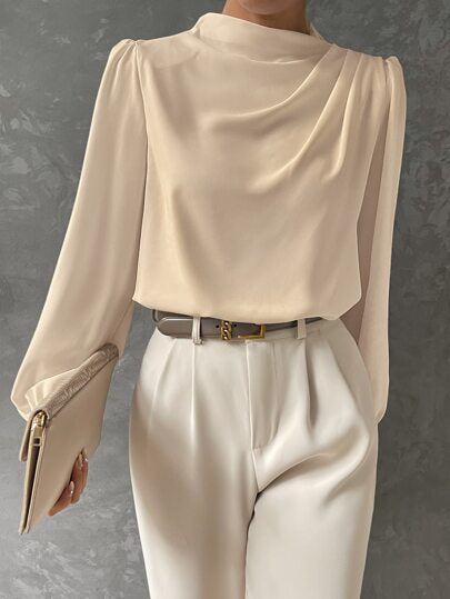 Elegant women's top showcasing voluminous bishop sleeves and a refined draped neckline for sophisticated appeal.