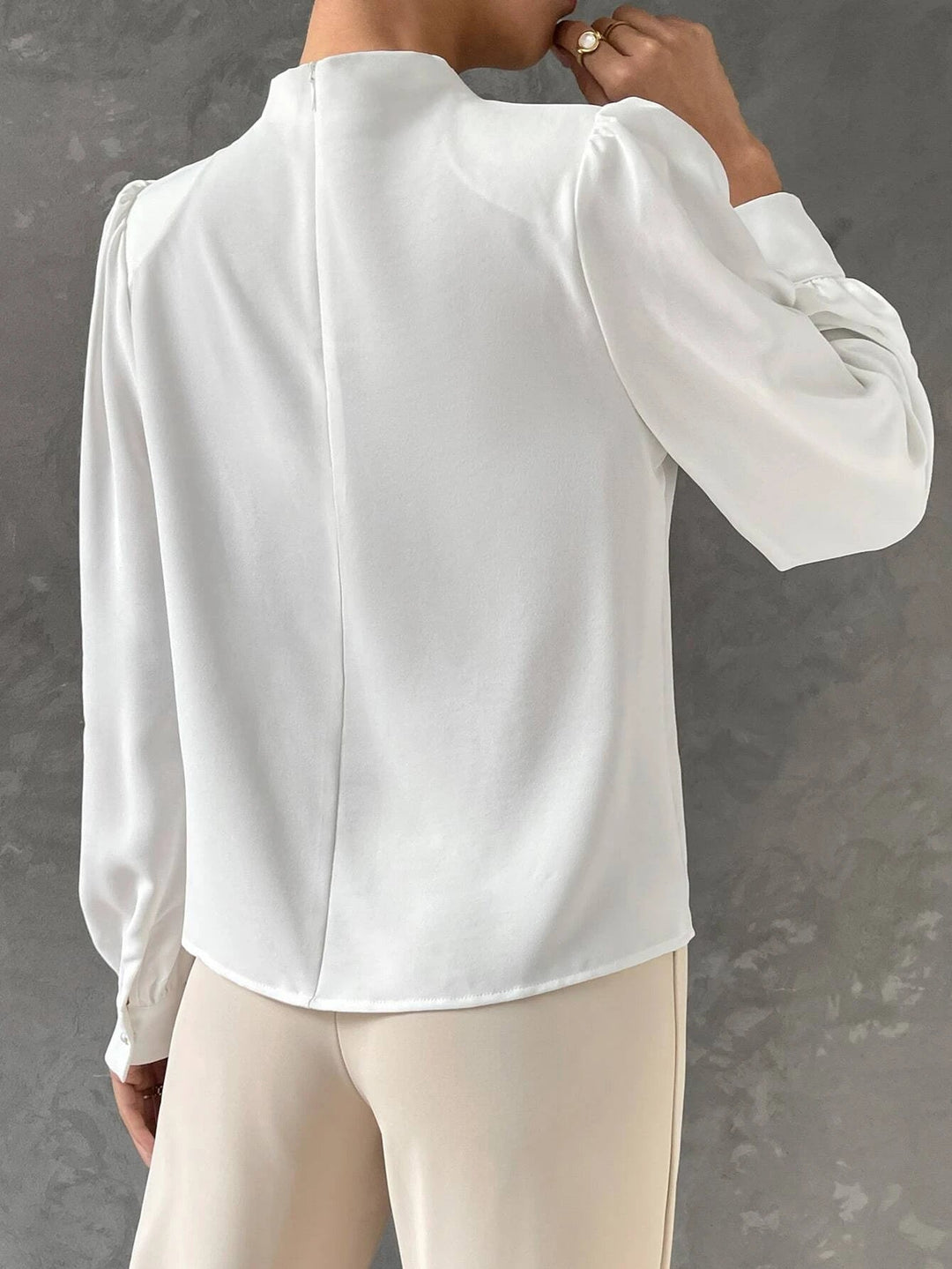 Chic evening blouse for women with elegant bishop sleeves and a dressy draped neckline, perfect for sophisticated style.