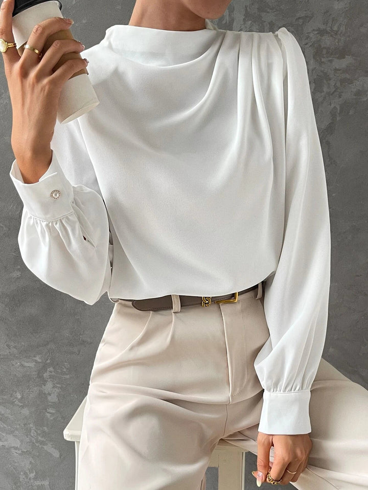 Versatile women's bishop sleeve blouse, ideal for casual chic or dressy occasions with its elegant draped neckline.