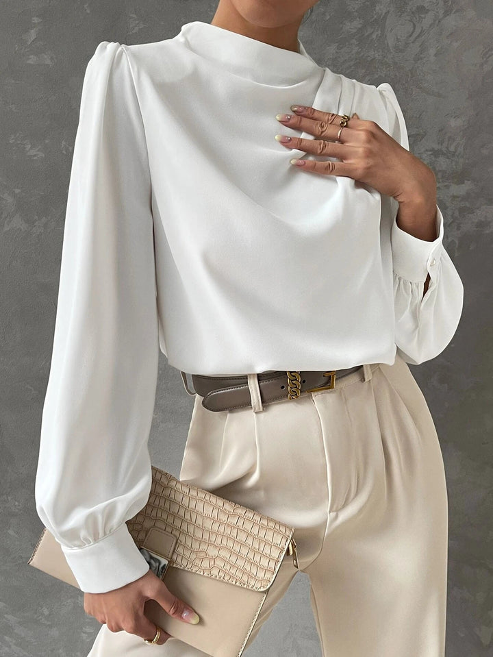 Elegant long sleeve women's blouse with dramatic bishop sleeves and a refined draped neckline for sophisticated style.