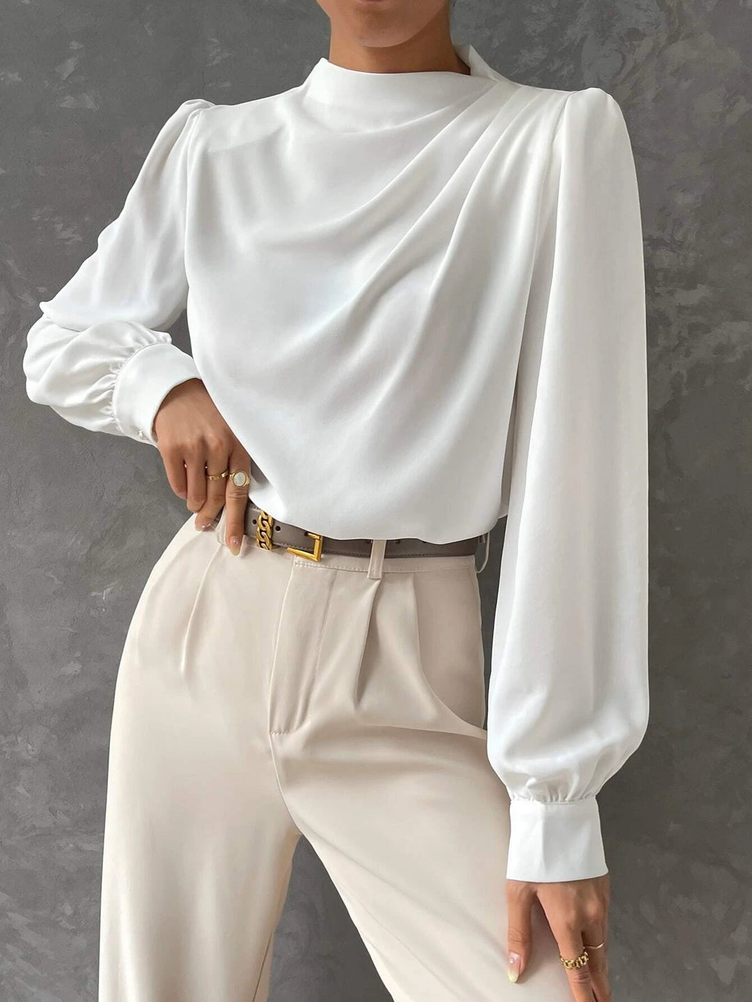 Women's elegant bishop sleeve blouse, a sophisticated fashion top with a draped neckline, suitable for various occasions.