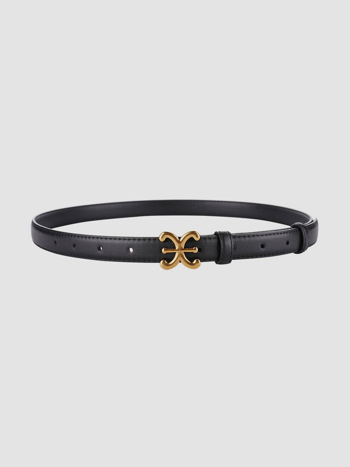 Versatile women's beige leather waist belt with unique sculpted buckle, ideal for accentuating dresses & outfits.