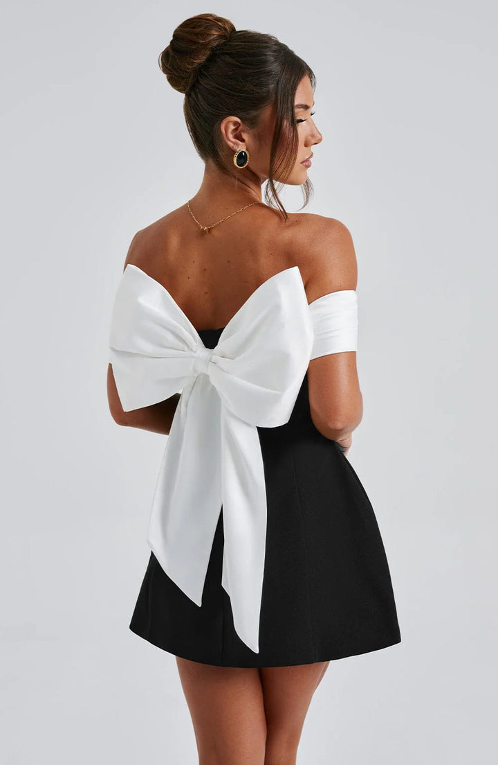 Stylish women's elegant black mini dress for parties, a sophisticated choice for evening wear.