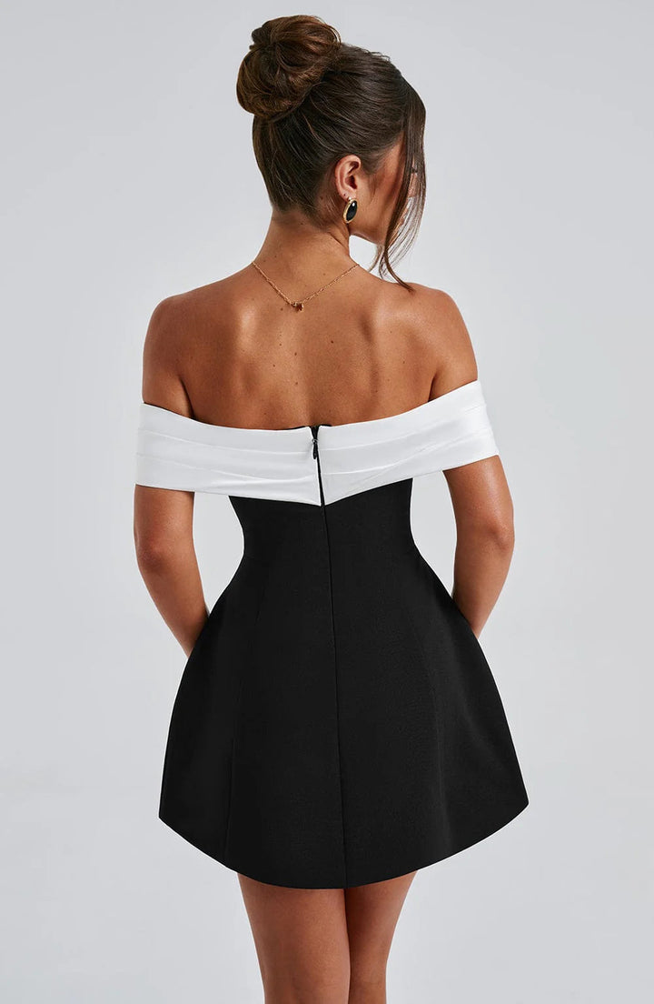 Sophisticated women's black mini dress with an elegant silhouette, perfect for romantic parties.