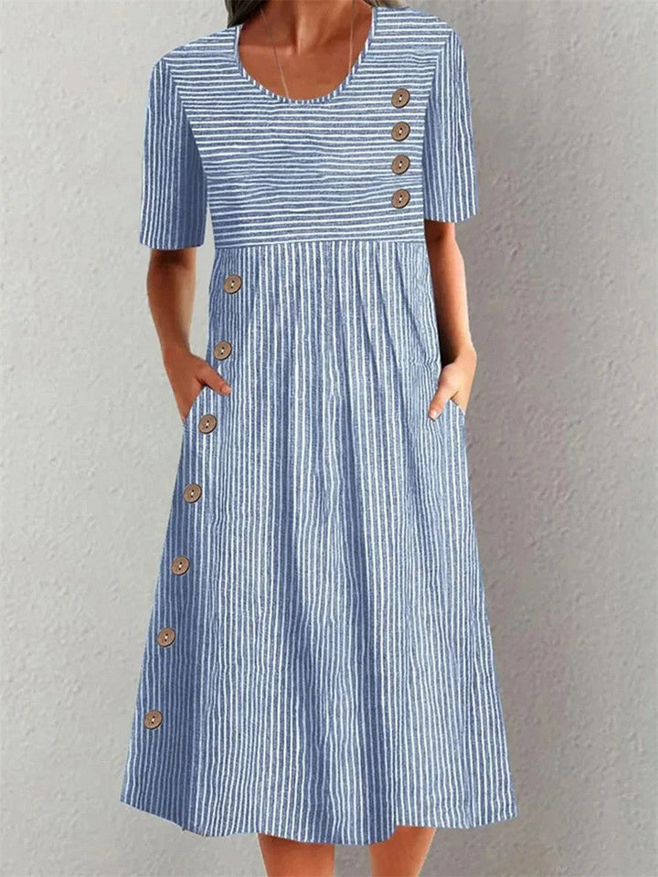 Elegant women's blue Linda A-line midi dress with stylish button details. Timeless and flattering for a sophisticated look.