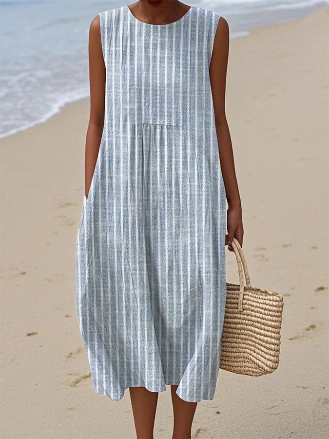 Elegant women's blue midi dress for day to night wear. Flattering and versatile for office, events, or casual sophistication.