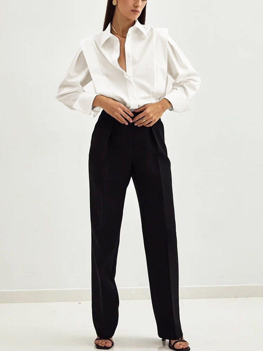Classic women's long-sleeve button-down square blouse, offering elegant style for daily and office wear.