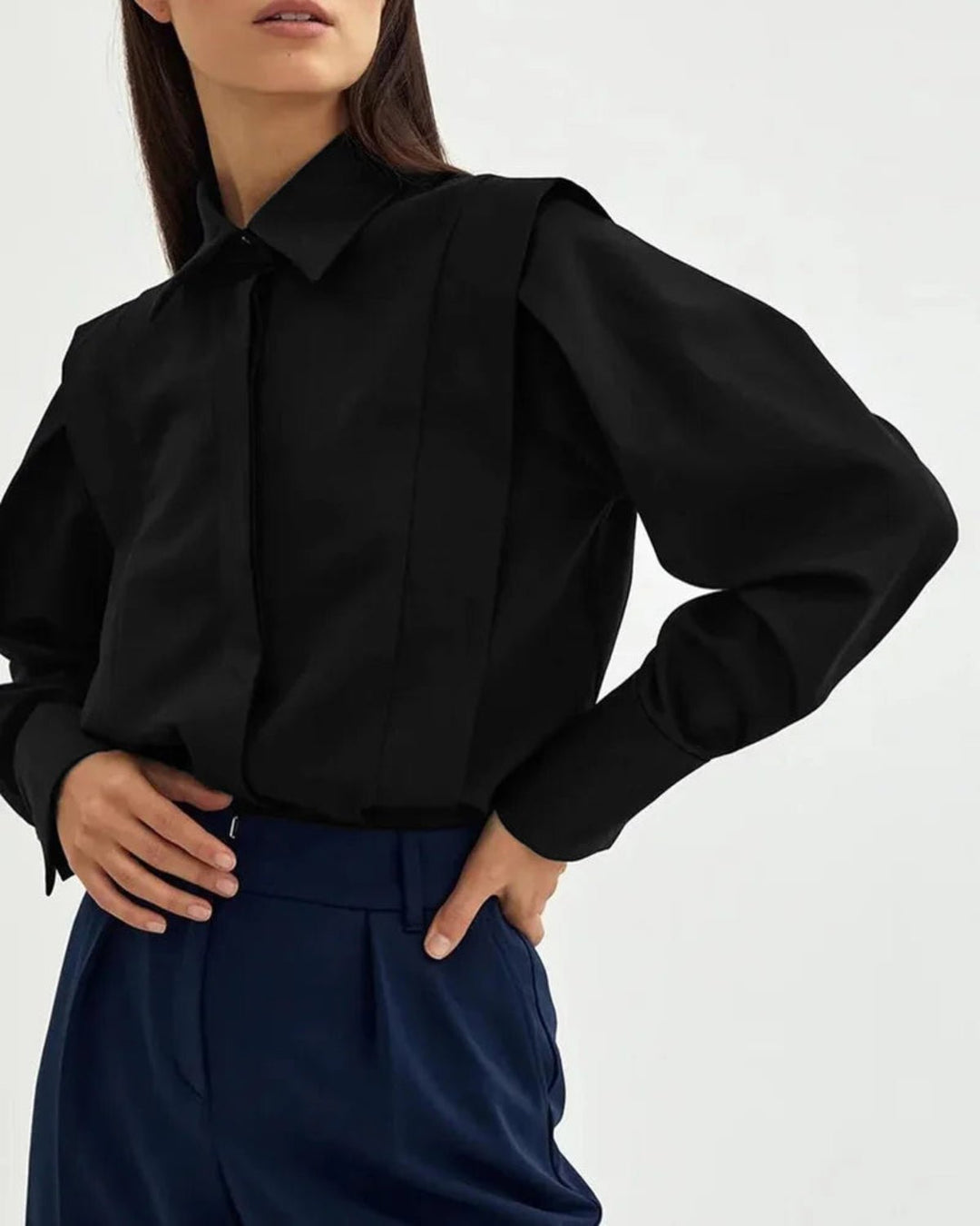Fashionable women's elegant button-down square shirt, versatile for both casual chic and office settings.