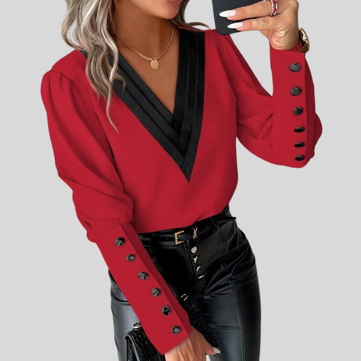 Elegant women's button-front blouse with dramatic gigot sleeves. Chic, versatile, long-sleeve top for modern fashion.