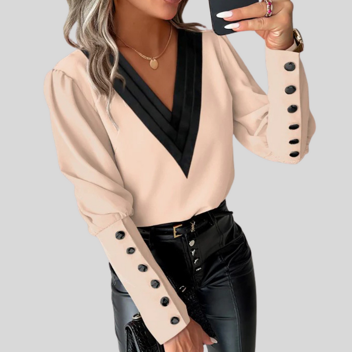 Modern women's button-front blouse with dramatic gigot sleeves. Sophisticated, versatile, long-sleeve top for any occasion.