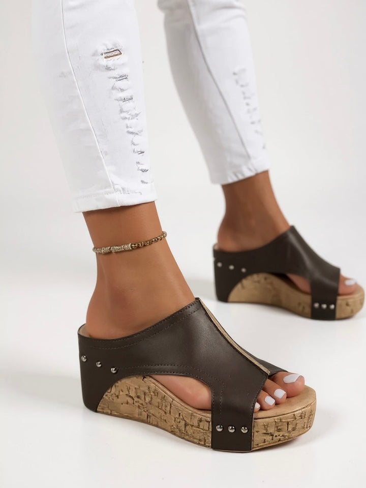 Comfortable women's wedge slide sandals, ideal summer footwear for casual or elegant outfits.