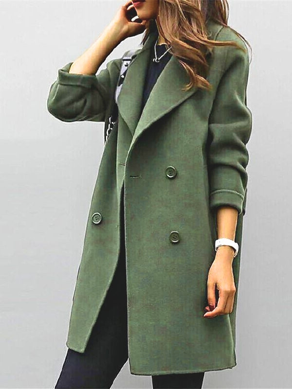 Elegant women's double-breasted long trench coat with classic lapel. Stylish autumn outerwear.