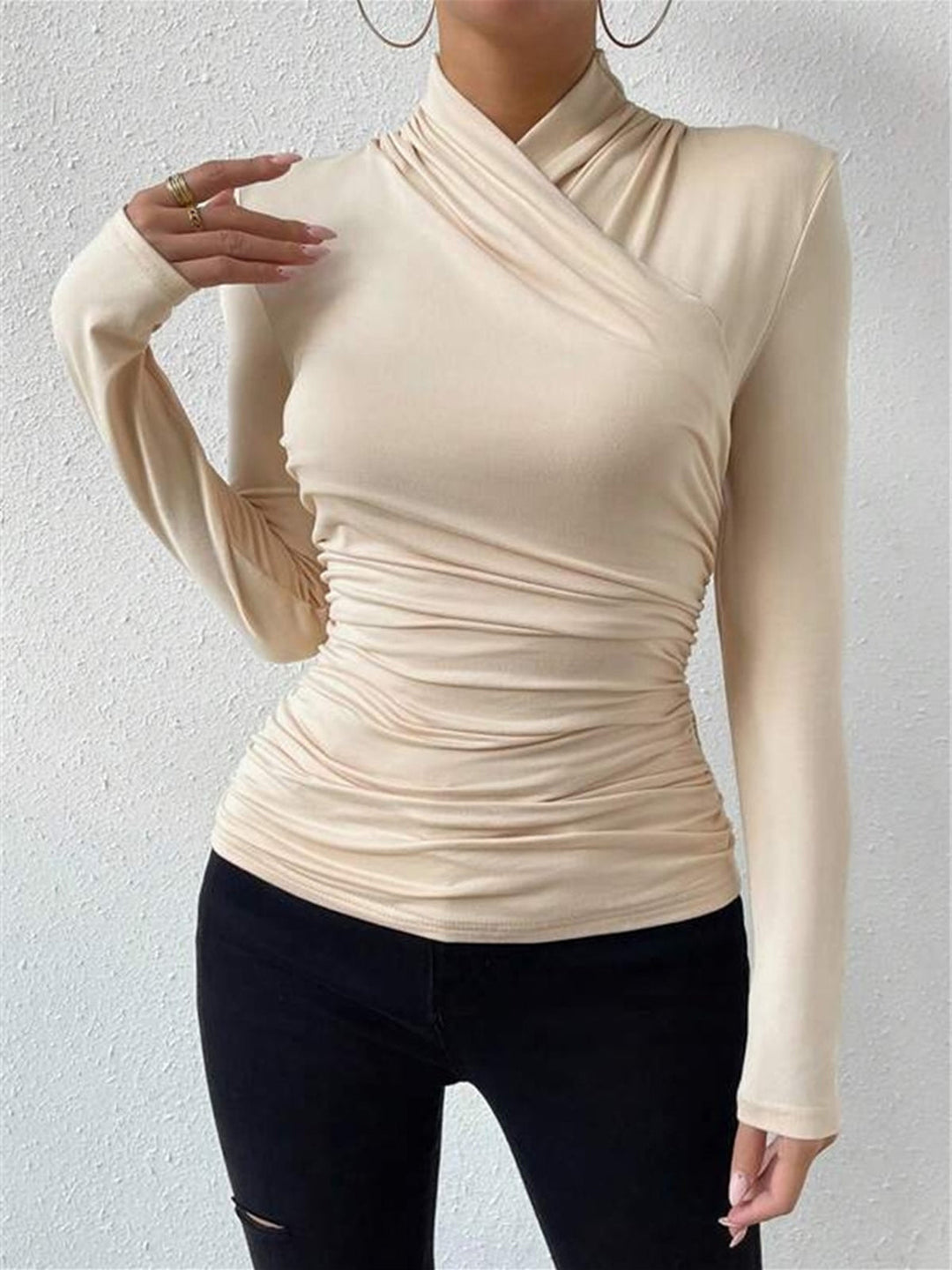 Sophisticated women's long sleeve top featuring a chic draped crossover design. Perfect for elegant looks.