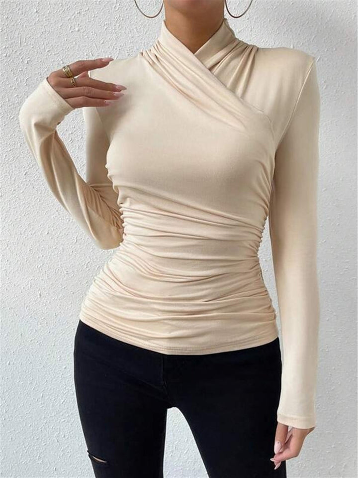 Sophisticated women's long sleeve top featuring a chic draped crossover design. Perfect for elegant looks.