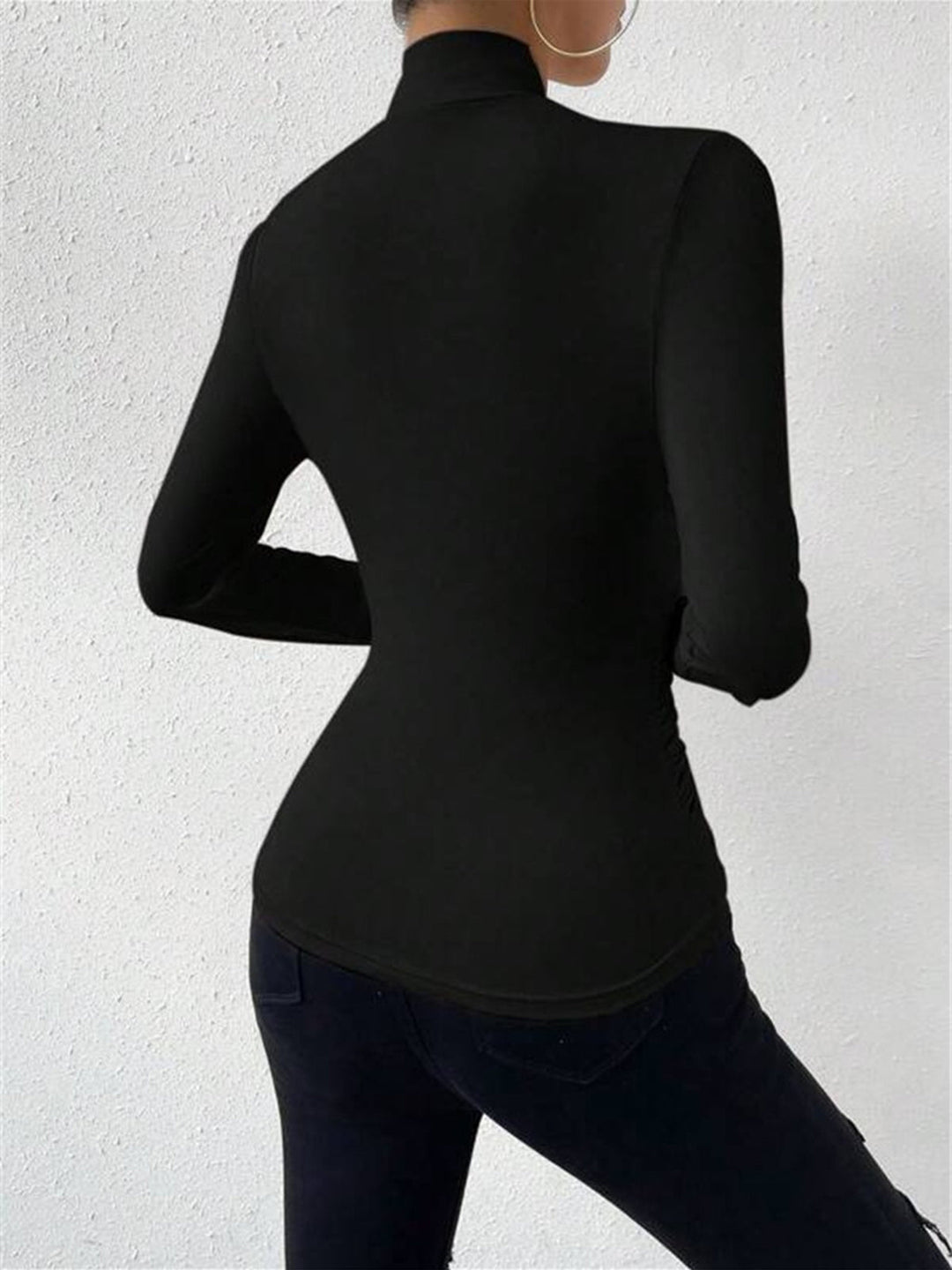Stylish women's autumn/winter long sleeve top with a unique draped crossover detail, offering a slim fit.