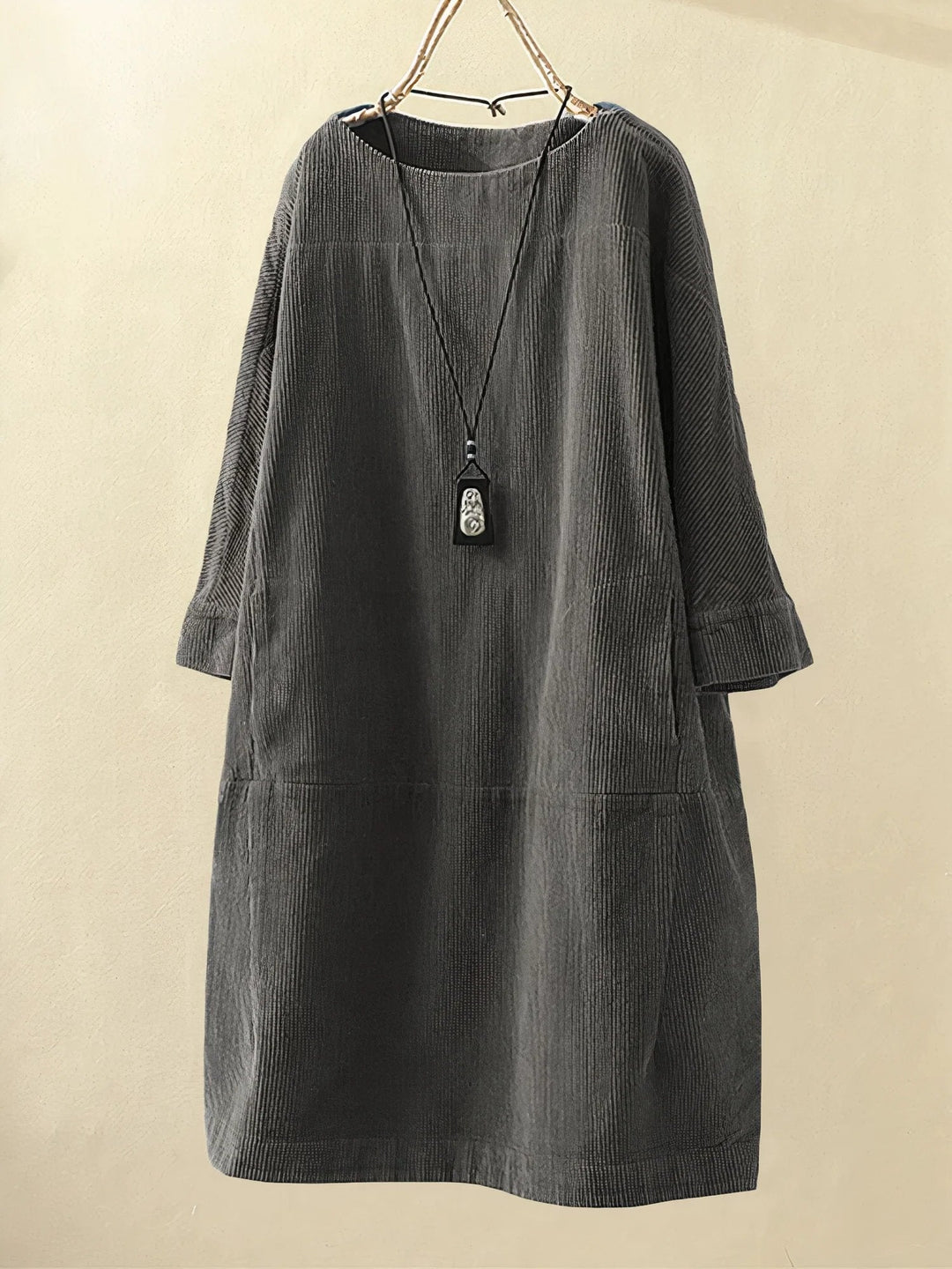 Women's elegant draped dress featuring tummy flattering comfort & a chic silhouette.