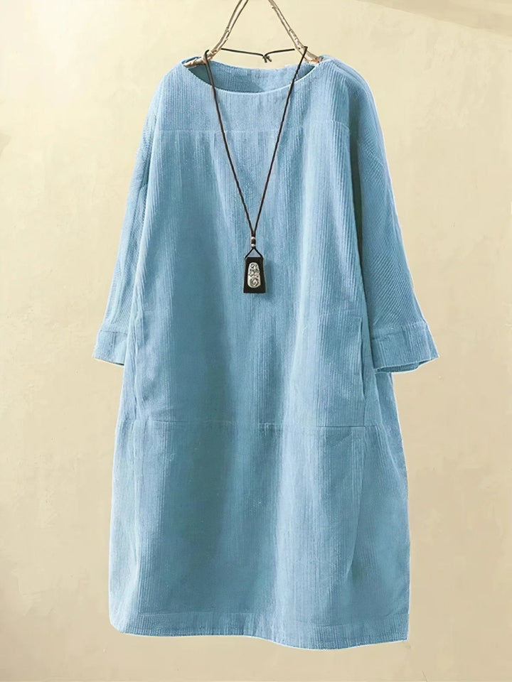 Women's elegant draped dress with tummy flattering design, comfort fit.