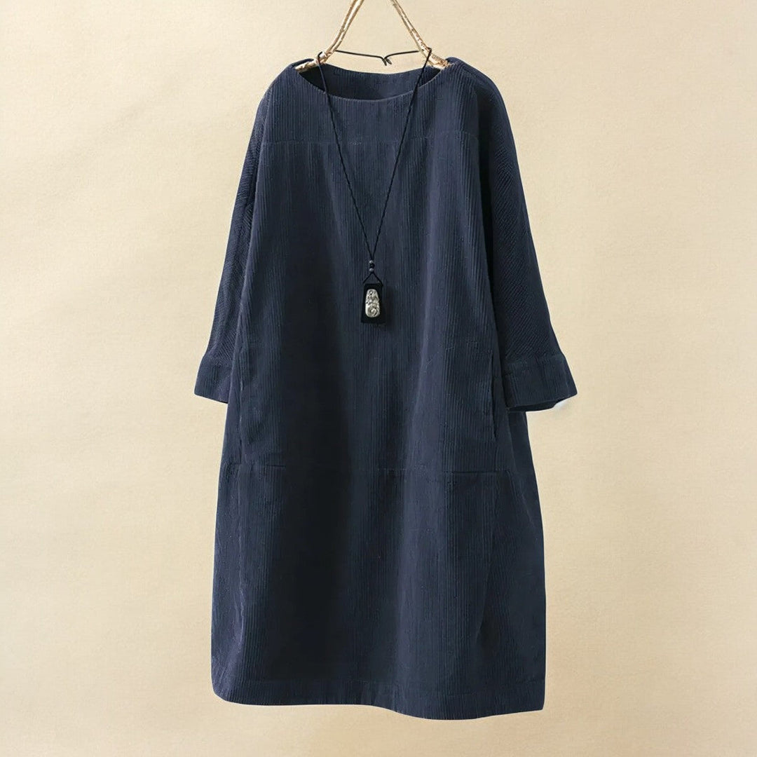 Tummy flattering women's draped dress, elegant comfort for a smooth silhouette.