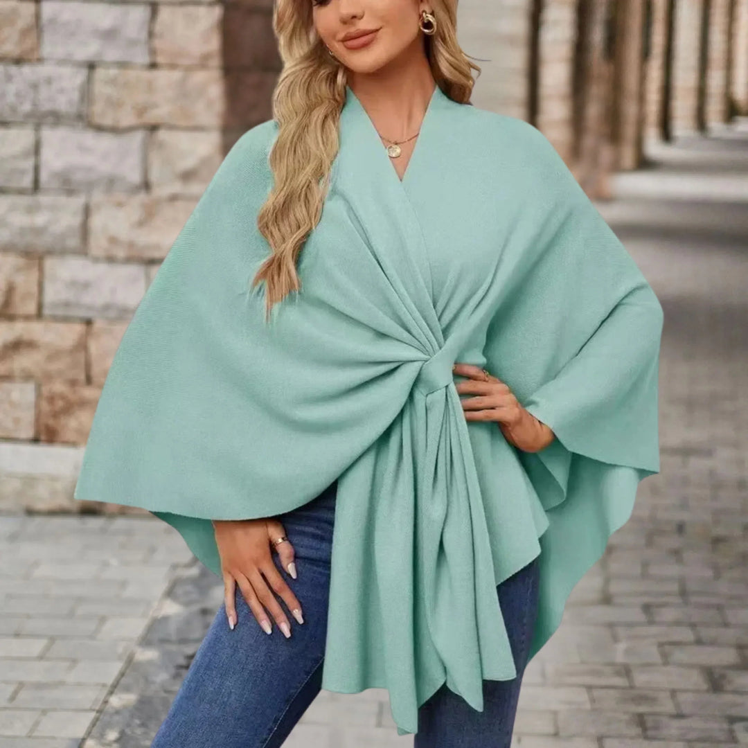Comfortable women's outerwear poncho, draped and flowing, an elegant one-size fashion wrap for any look.