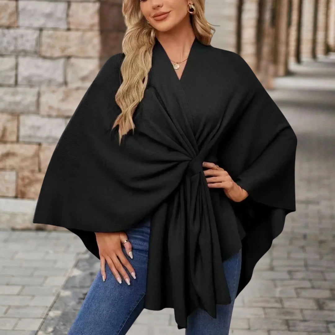 Versatile women's poncho, elegantly draped and flowing, a comfortable one-size fashion wrap outerwear.