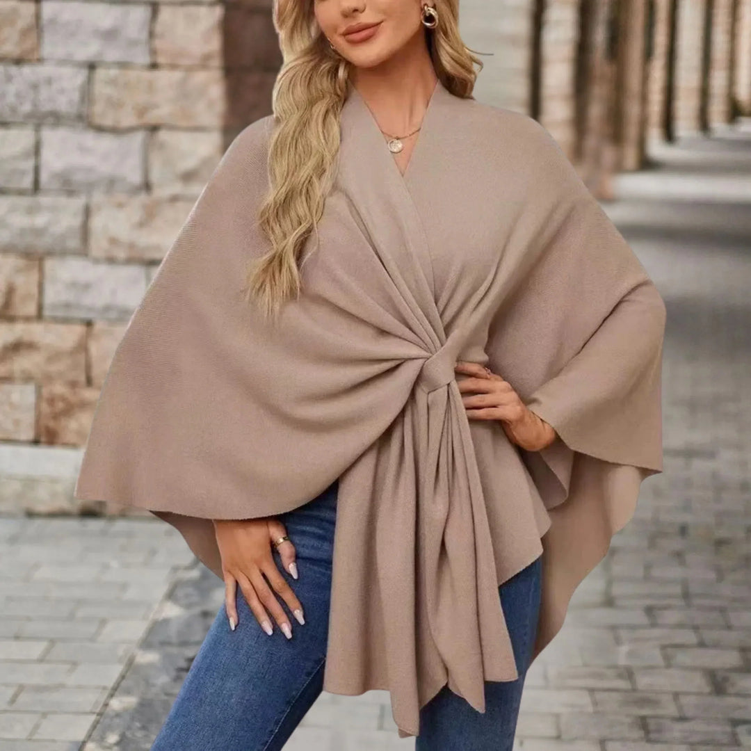 Comfortable women's draped poncho, a stylish one-size fashion wrap for elegant and versatile outerwear.