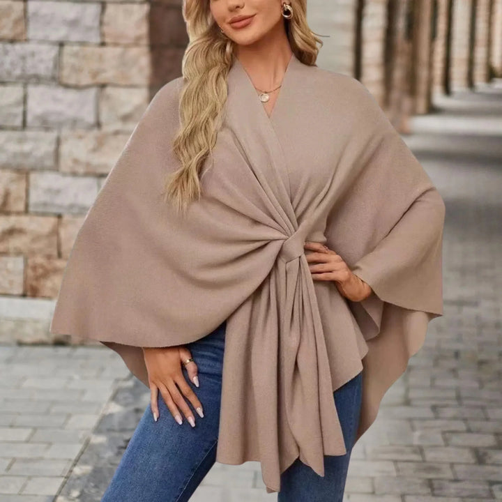 Comfortable women's draped poncho, a stylish one-size fashion wrap for elegant and versatile outerwear.