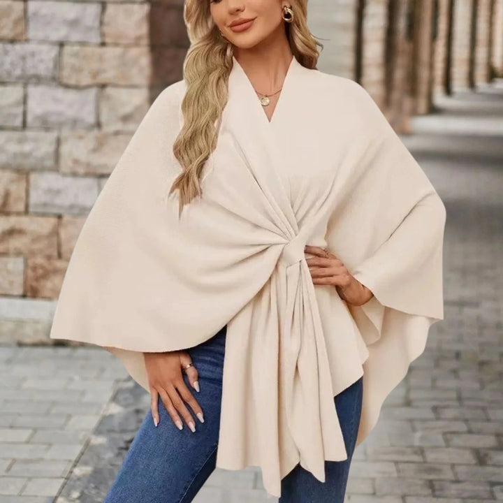 Stylish women's flowing poncho, an elegant draped fashion wrap for comfortable and versatile outerwear.