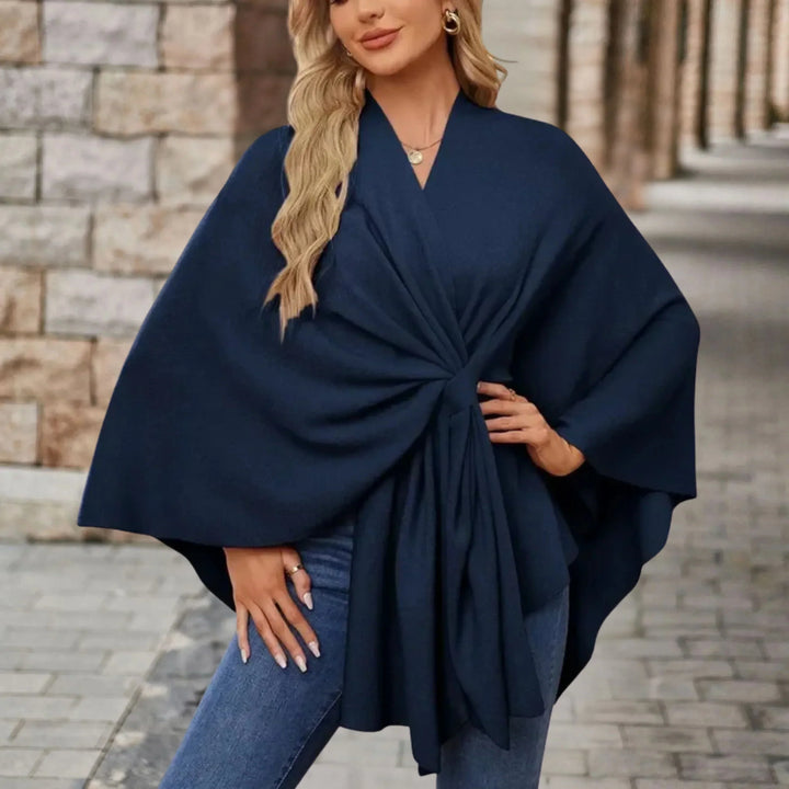 Flowing draped women's poncho, a versatile and stylish fashion wrap perfect as comfortable outerwear.
