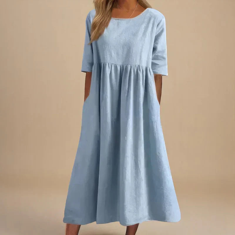 Elegant women's flattering flowing midi dress. Perfect for occasion wear or a stylish summer look.