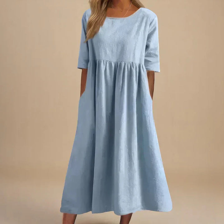 Elegant women's flattering flowing midi dress. Perfect for occasion wear or a stylish summer look.