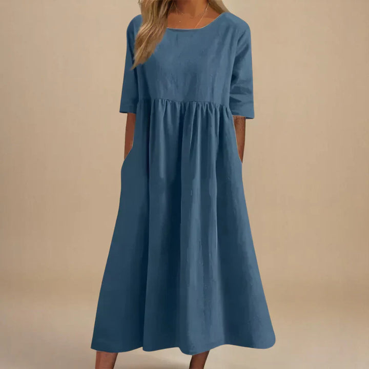 Comfortable women's flowing summer dress, offering an elegant & flattering silhouette for any occasion.