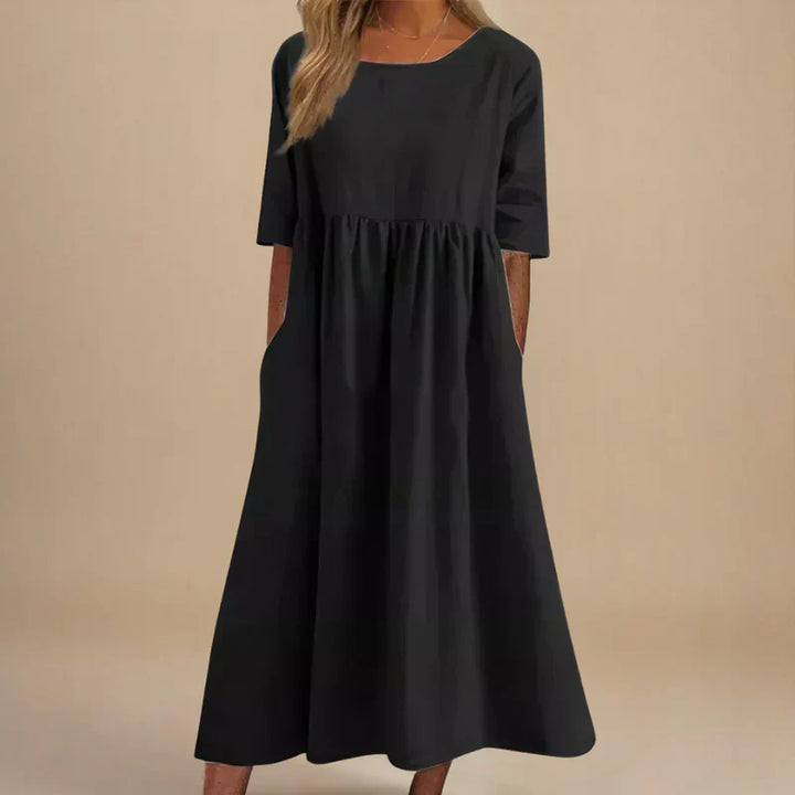Flowing summer midi dress for women. Elegant, flattering, and comfortable, perfect for casual or party wear.